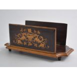 An inlaid wooden hinged desk rack, the two sides folding down and decorated with dragons,
