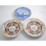 A pair of Japanese plates in the Imari style with a border of birds, 30cm diameter,