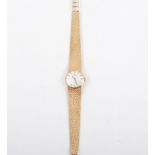 Tissot - A lady's 9 carat yellow gold bracelet watch,