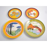 Fourteen Wedgwood Clarice Cliff small plates,