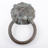 Large cast metal lion's head door knocker, ring mask, 29cm overall.