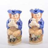 Two Staffordshire Toby jugs with covers, holding ale flagons,26cm,
