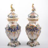 Pair of French faience covered vases, with parrot finials to the domed lids,