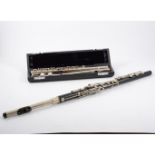 Two cased flutes and a music stand,
