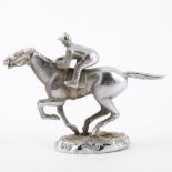 A car mascot, white metal horse and jockey, 14cm wide 9cm high.