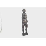 Carved African hardwood paternity figure, male form with child on shoulders, possibly Songye,