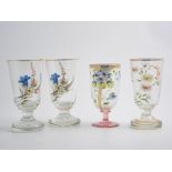 Five Bohemian glass wine goblets and seven sherry/madeira glasses all having applied hand painted