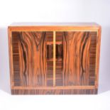 An Art Deco table cabinet, circa 1930, walnut, macassar, and satinwood,