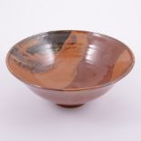 Chris Carter, a stoneware tenmoku glaze bowl, conical form, impressed seal to underside, 25cm diam.