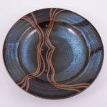 Derek Emms, a stoneware bowl, with flared rim, tenmoku glaze interior with wavy line design,