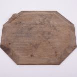 Robert 'Mouseman' Thompson of Kilburn, an oak octagonal bread board, carved signature mouse,