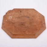 Robert 'Mouseman' Thompson of Kilburn, an oak octagonal bread board, carved signature mouse,