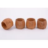 Robert 'Mouseman' Thompson of Kilburn, a set of four oak napkin rings, swollen octagonal form,