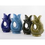 Four Dartmouth Pottery Gurgling fish jugs for Plymouth Gin,