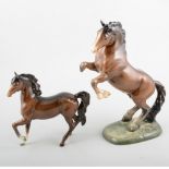 Beswick model of rearing stallion, no.1014, 27cm; and a Beswick model of a chestnut horse, (2).