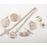 A collection of jewellery and badges, an oval silver locket, ankh cross and chain,