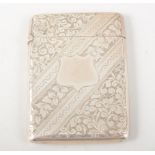 A silver card case, engraved diagonal panels with scroll and ivy leaves, 92cm x 66cm,