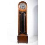 1940s oak triple chain longcase clock, by Enfield, the movement striking on gongs, 192cm.