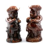 Two Staffordshire treacle glaze toby jugs, Mr Toby taking snuff, with covers/hats,