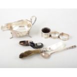 Silver sauceboat, spoon, letter knife, napkin rings and thimbles.