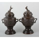 Pair of Japanese bronze Koro, pierced tops, the bodies with birds and flowers, 26cm.