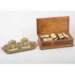 Set of bone-faced dominoes, an oak musical box, and an Edwardian brass desk stand.