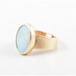 An opal dress ring, the oval cabochon cut stone, 14mm x 9mm,