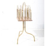 Edwardian brass and oak newspaper/ magazine rack, raised on a stand.