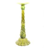 Green glazed earthenware jardiniere stand, probably Bretby, moulded in relief, 90cm high.