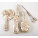 Chinese white metal four-piece dressing table set, embossed decoration of dragons,