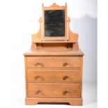 STained wood dressing chest with mirror back,