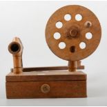 Oak bobbin winder and a small collection of wooden bobbins.