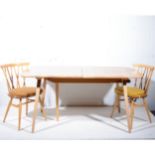 Ercol extending dining table, together with six ‘Chiltern’ dining chairs,