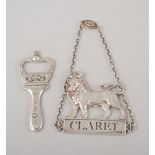 Silver Claret label "The Hugh Johnson Collection" and a silver bottle opener formed as a coronet,