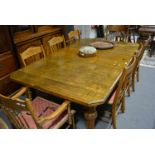 19th century oak extending dining table, with three additional leaves,