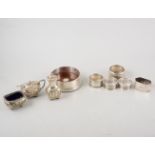 Silver coaster; condiment set; five napkin rings,