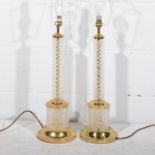 Pair of crystal column table lamps with gilt metal mounts,