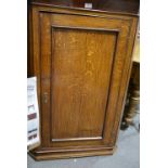 George III oak and mahogany hanging corner cupboard, cavetto moulded cornice, plain frieze,