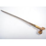 An antique Turkish sword, yataghan, the ivory hilt straps set with coral cabochons, the blade 58cms,