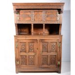 Carved oak court cupboard, 18th century and later, two cupboards above an open gallery,