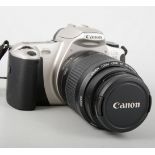 Canon EOS300 SLR camera with carry case, along with other cameras equipments and cables.