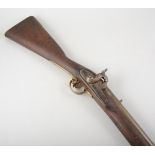 A percussion musket, sighted barrel, brass mounts, the lock stamped with Crown, Tower 1844,