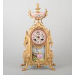French gilt painted spelter, and Sevres style porcelain mantel clock, in the Transitional style,