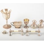 A collection of small silver items, a pair of oval half fluted pepper pots,