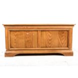 Modern oak cabinet made blanket box, width 110cm, depth 59cm, height 50cm.