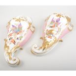 Pair of Continental porcelain wall pockets, painted with exotic birds,