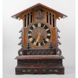 Black Forest stained wood Cuckoo clock, carved case, single fusee movement striking on a gong,