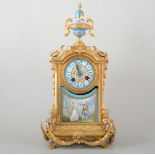 Gilt metal and Sevres style porcelain mantel clock in the Louis XVI taste, urn finial,