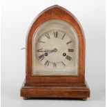 Edwardian oak mantel clock, lancet case, striking on a gong, 30cm.