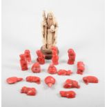 Sixteen coral coloured animals and Buddhas, average 5cm,